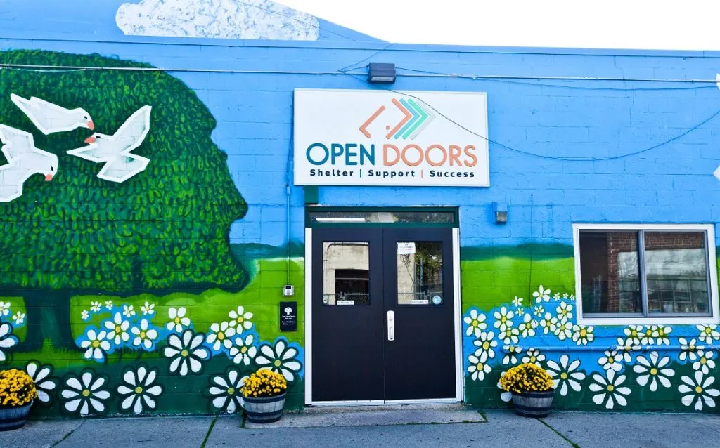 Open Doors non-profit organization colorful mural building - Rosebrook AI client success story